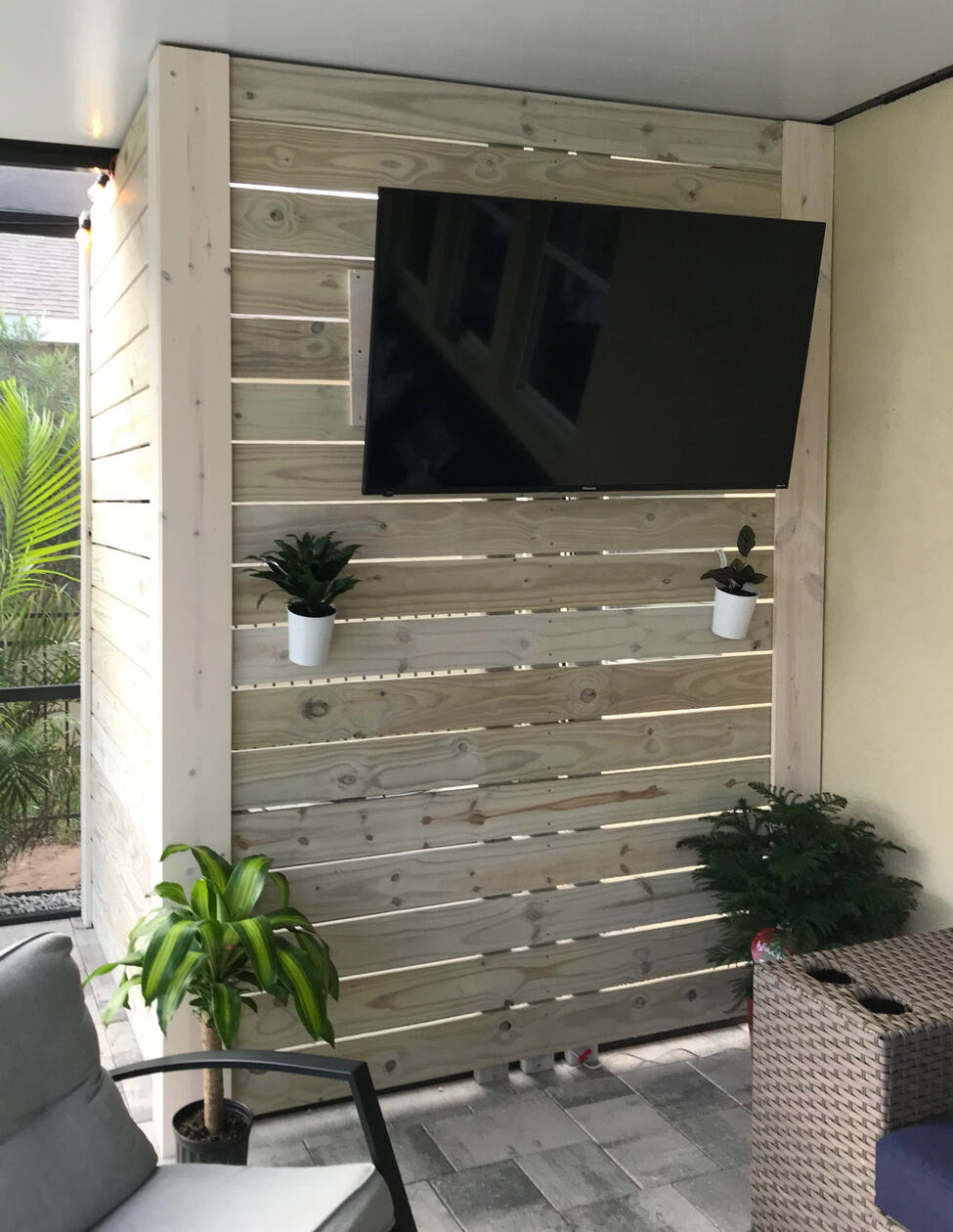 Privacy screen with mounted tv
